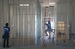 Commercial Electrical Contractor climbing a ladder in Fort Lauderdale 